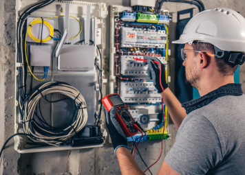 Burnt electrical socket and faulty wiring warning signs in Dubai apartment