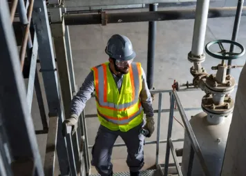 Eagles Crew LLC technician performing preventive plumbing maintenance in a high-rise building in Deira Dubai