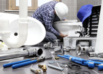 Professional building maintenance services team inspecting HVAC system in a commercial property in Dubai