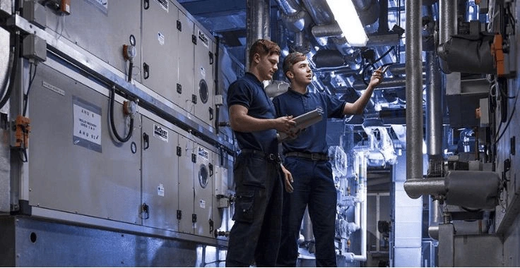 HVAC technician repairing an air conditioning unit in Dubai